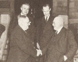 Handshake between William L. Phillips and Samuel W. McGinness